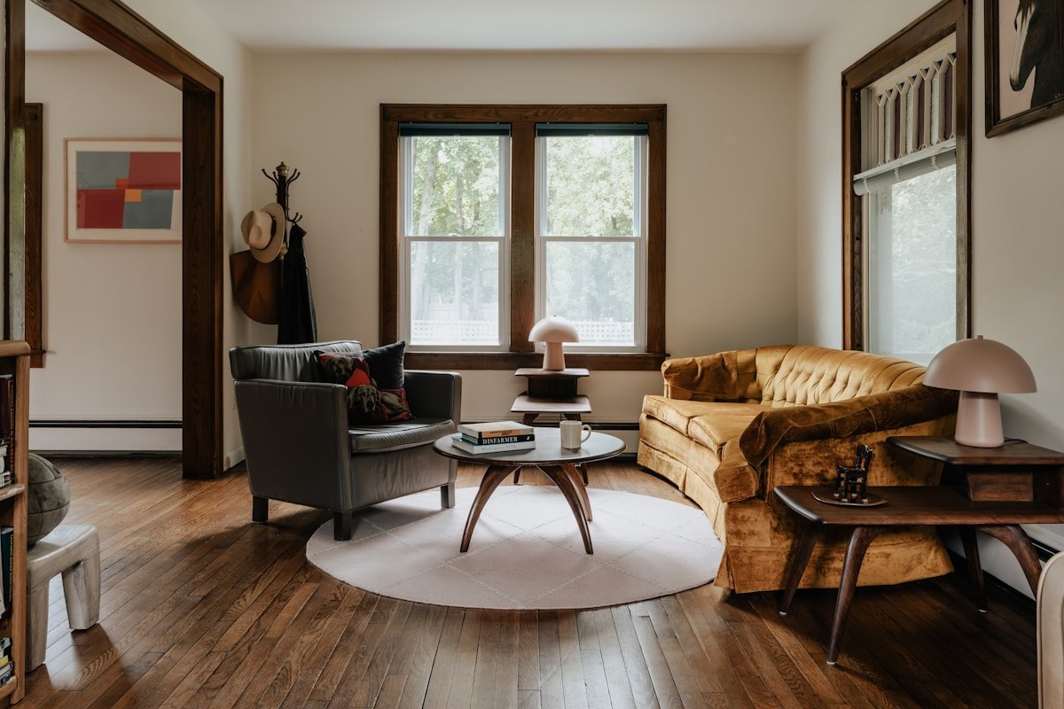 A living room filled with furniture and a wooden floor